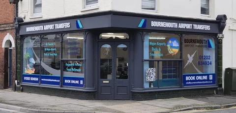 The Bournemouth Airport Transfers office in Christchurch, with branded signage across the corner shopfront